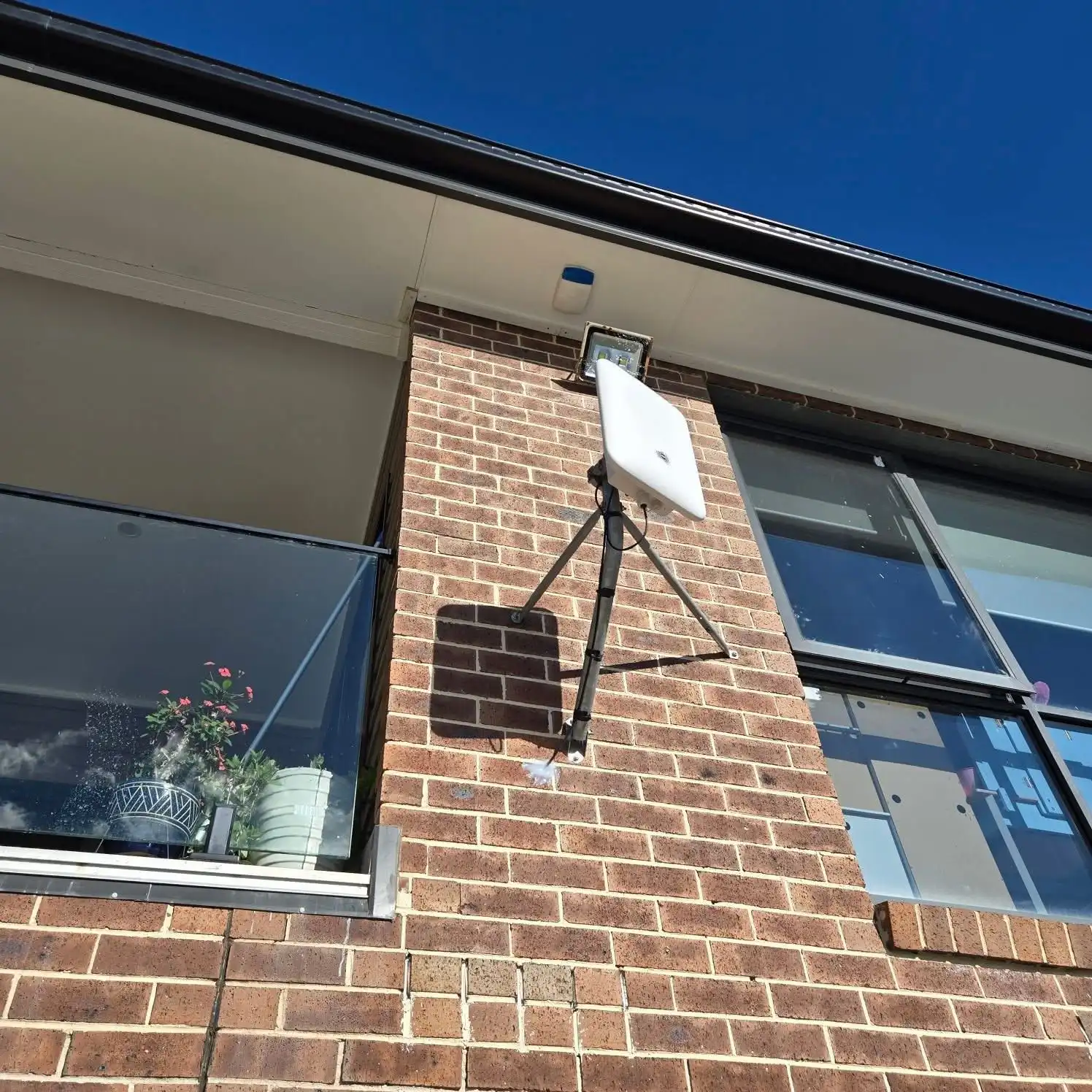 nbn Fixed Wireless outdoor antenna on a house roof